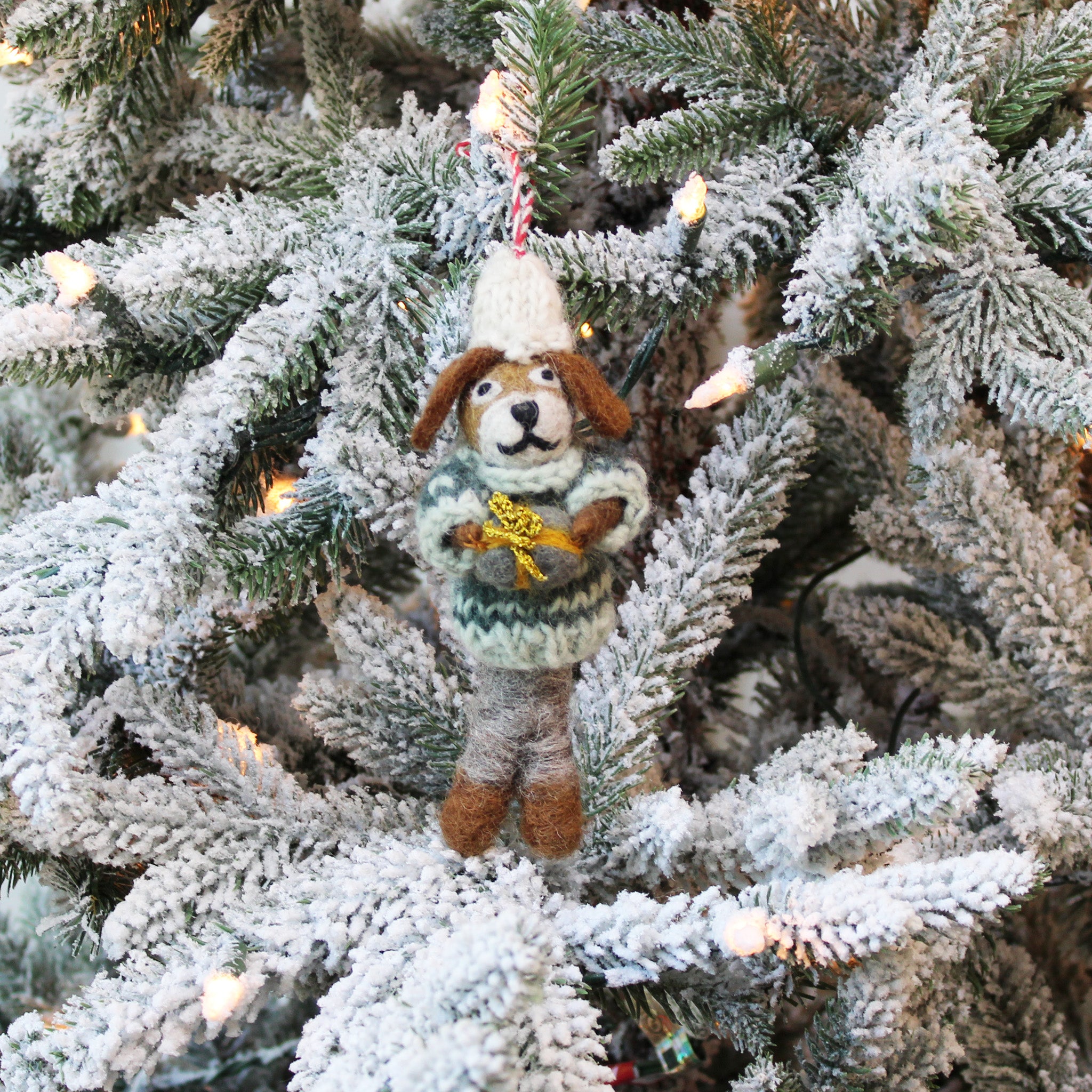 Dog Holding a Gift Ornament